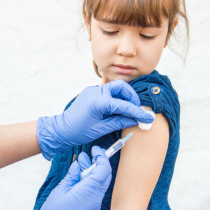 child receiving a vaccination